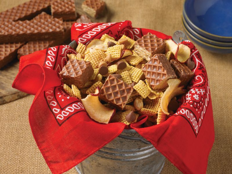 A bowl of snacks with a red bandana on it