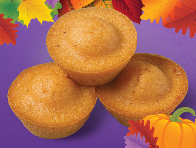 three stacked pumpkin spice mini donuts on a purple background with a pumpkin drawing