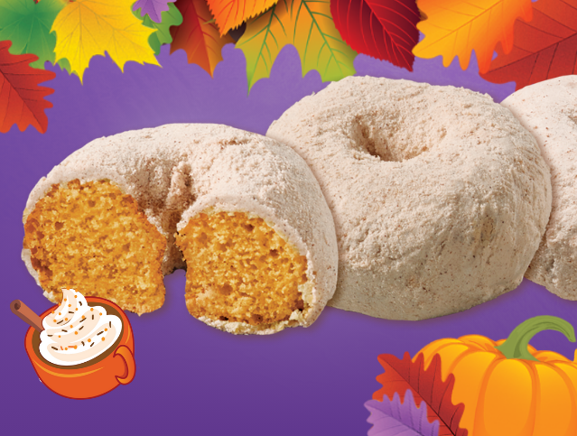 three pumpkin spice mini donuts with one missing a bite