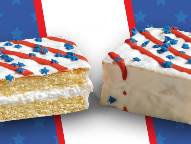 two red white and blue cakes with one sliced in half