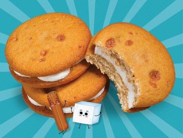 A stack of cookies with a marshmallow and a hot dog