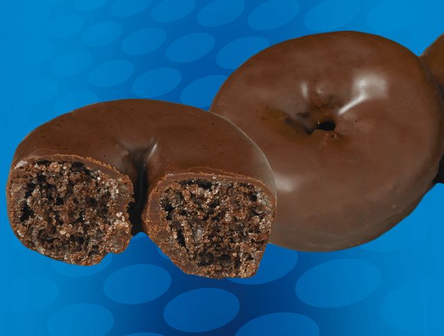 A chocolate donut with a bite taken out of it