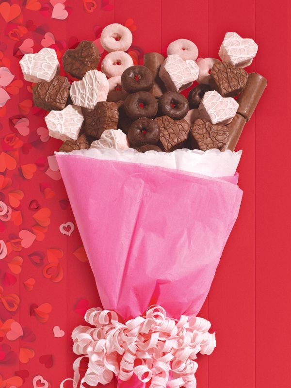 assorted valentine cakes with mini donuts in pink wrapping