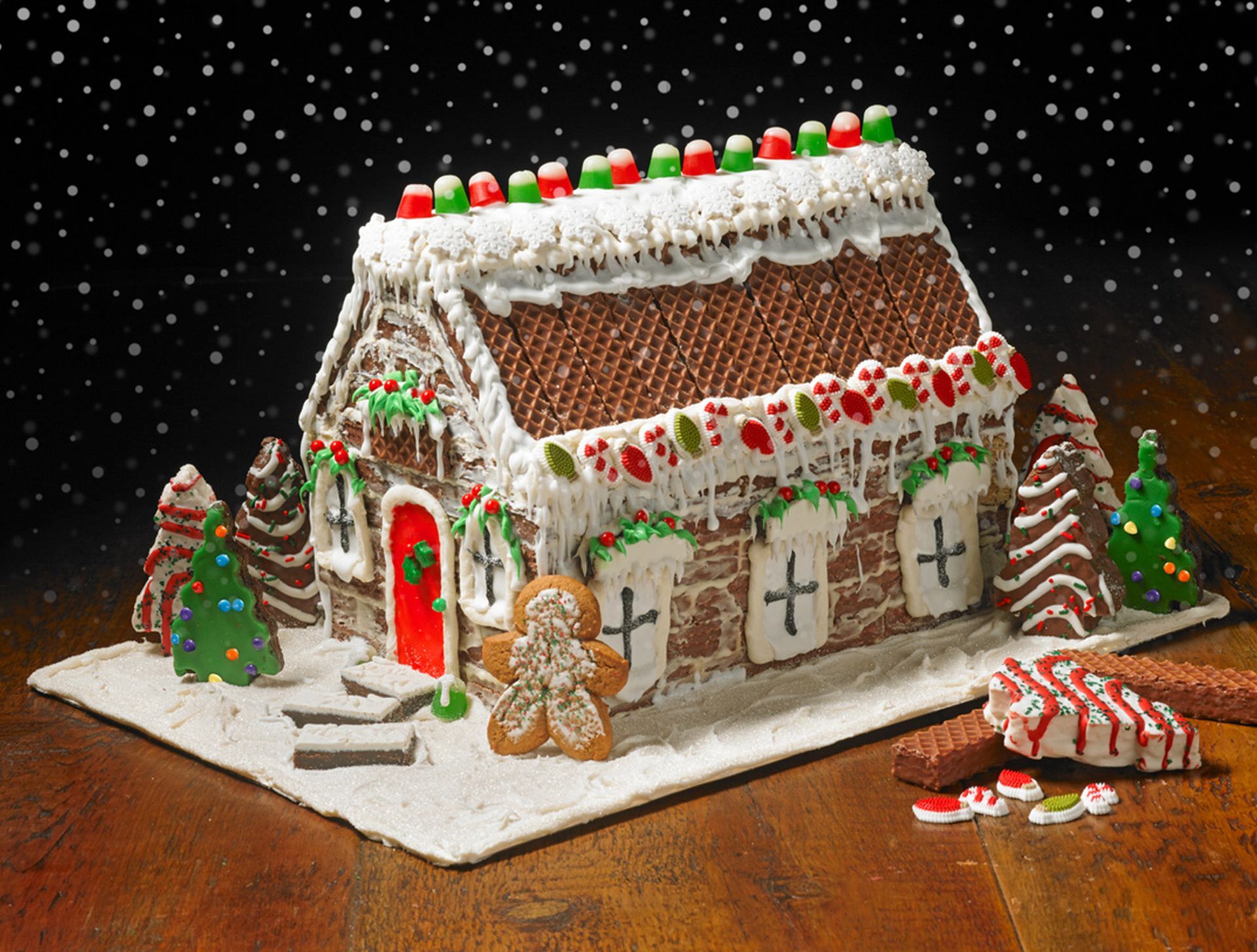 a house made of nutty buddy wafer bars decorated for christmas