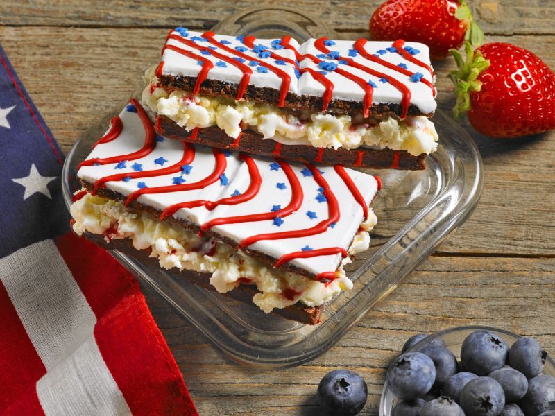 red white and blue iced brownies with ice cream in the middle