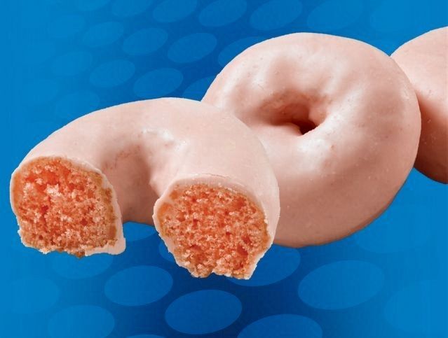 A donut with a bite taken out of it on a blue background