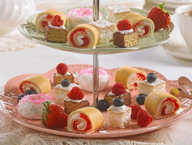 assorted cakes and wafer bars on a tea party serving platter