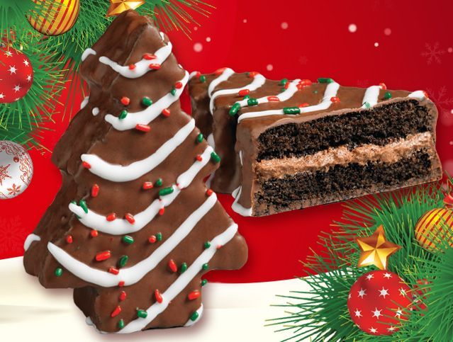 a christmas tree shaped cake next to a slice of cake