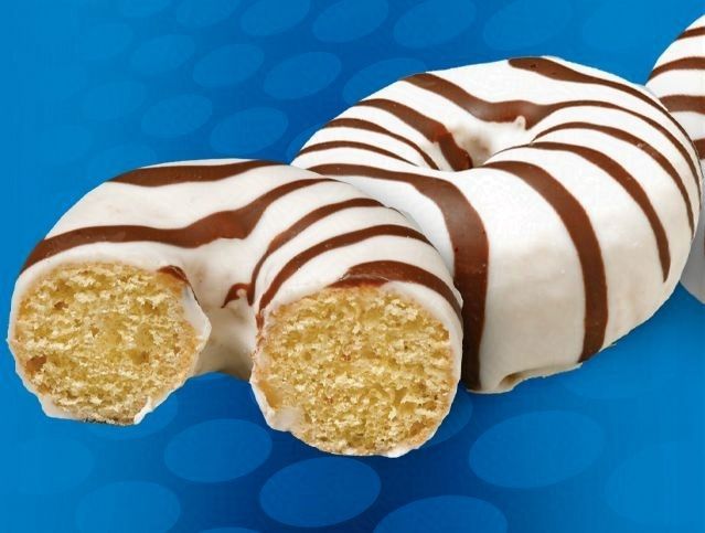 A zebra print donut with a bite taken out of it