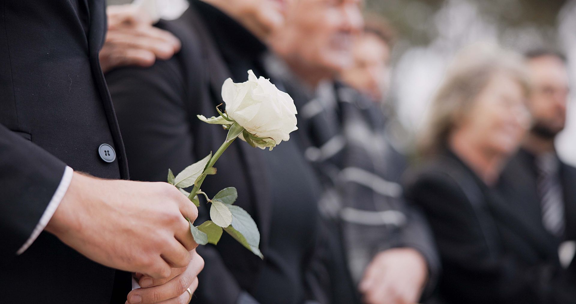 A person in a funeral. All Faiths Funerals offers local pre-paid funeral arrangements options.