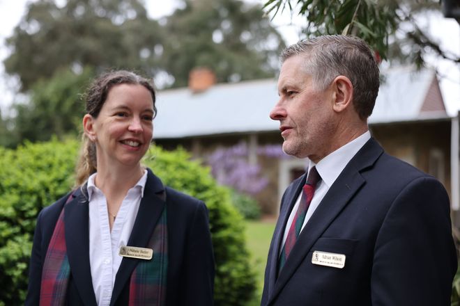 Funeral Directors, Natalie and Adrian, speaking together outside