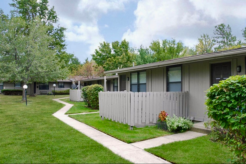 A row of houses with a walkway leading to them