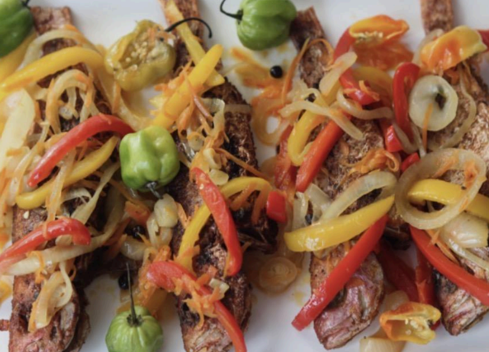 Colorful shredded vegetable and meat stir-fry with red peppers, yellow strips, and green peas