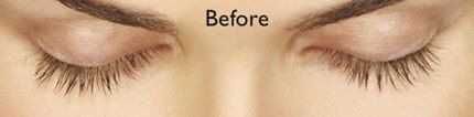 Eyes with closed lids, showing eyelashes and eyebrows. Text