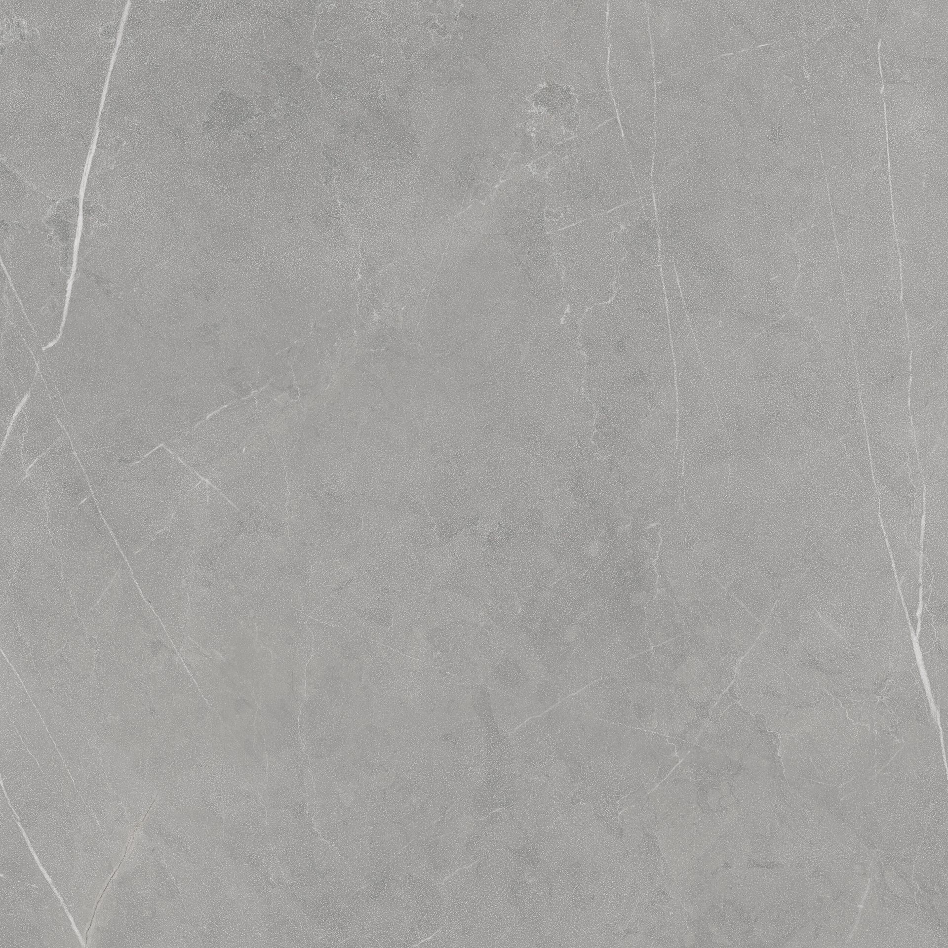 Superficie de piedra o concreto de color gris claro con vetas blancas tenues y textura sutil.