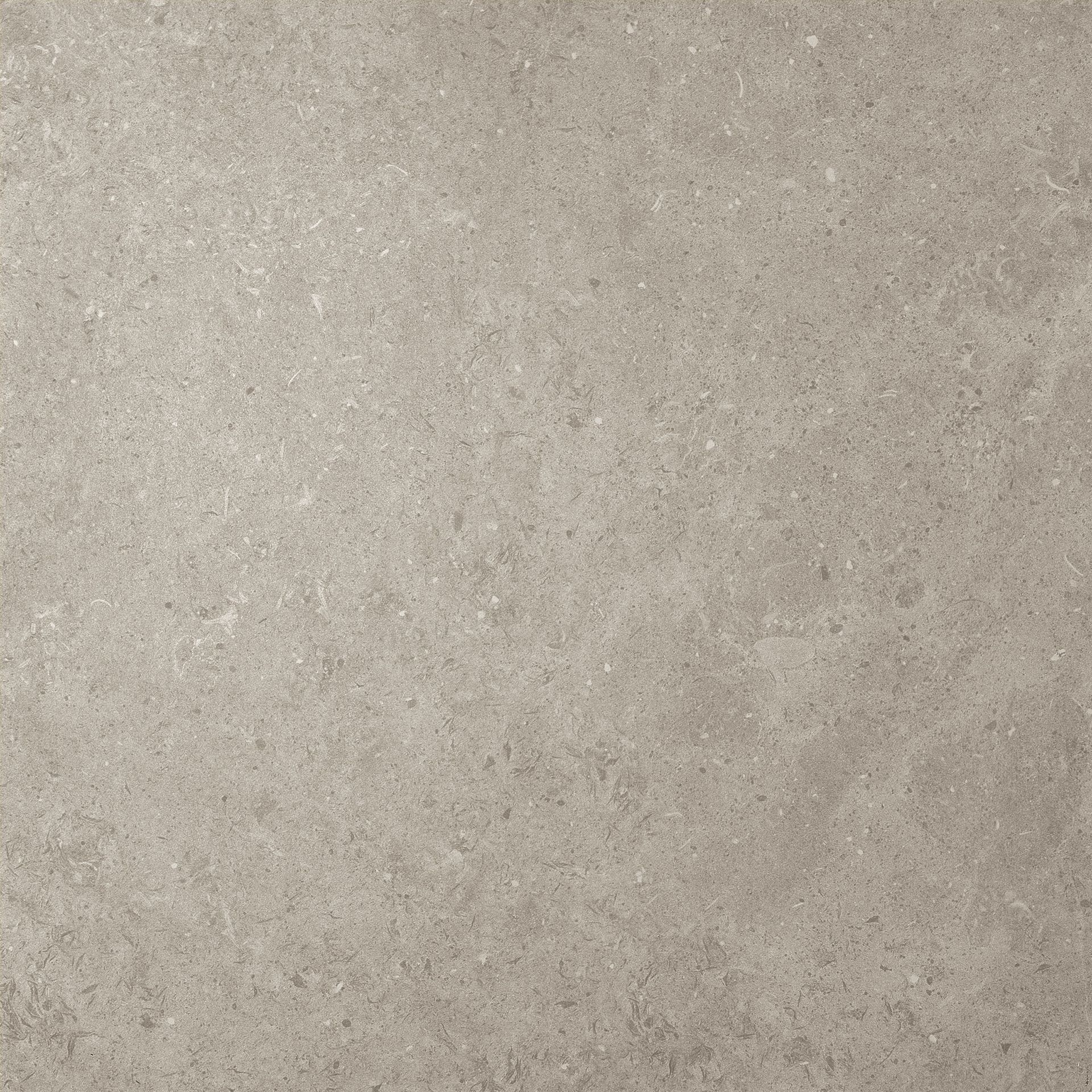 Primer plano de una pared o superficie de tela de color beige con textura.