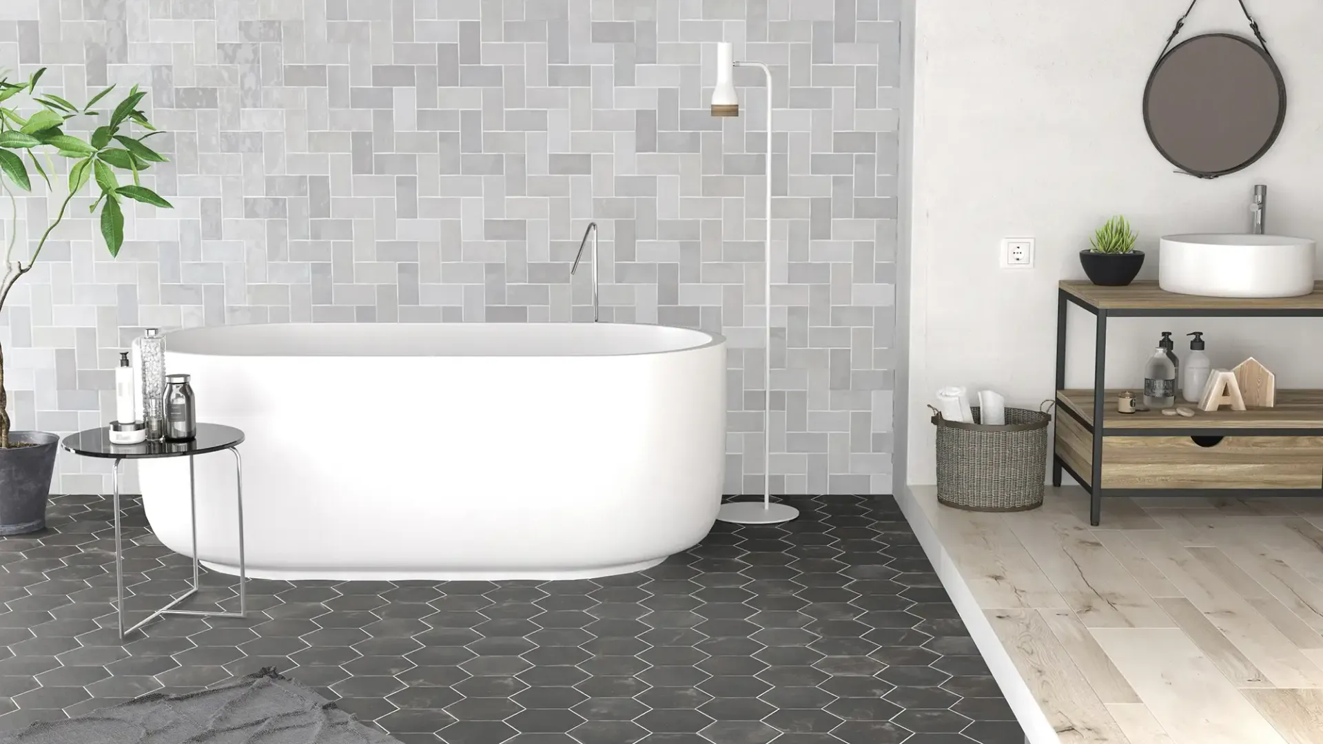 Baño moderno con bañera exenta blanca, pared de azulejos grises, suelo negro y decoración con estantes de madera.