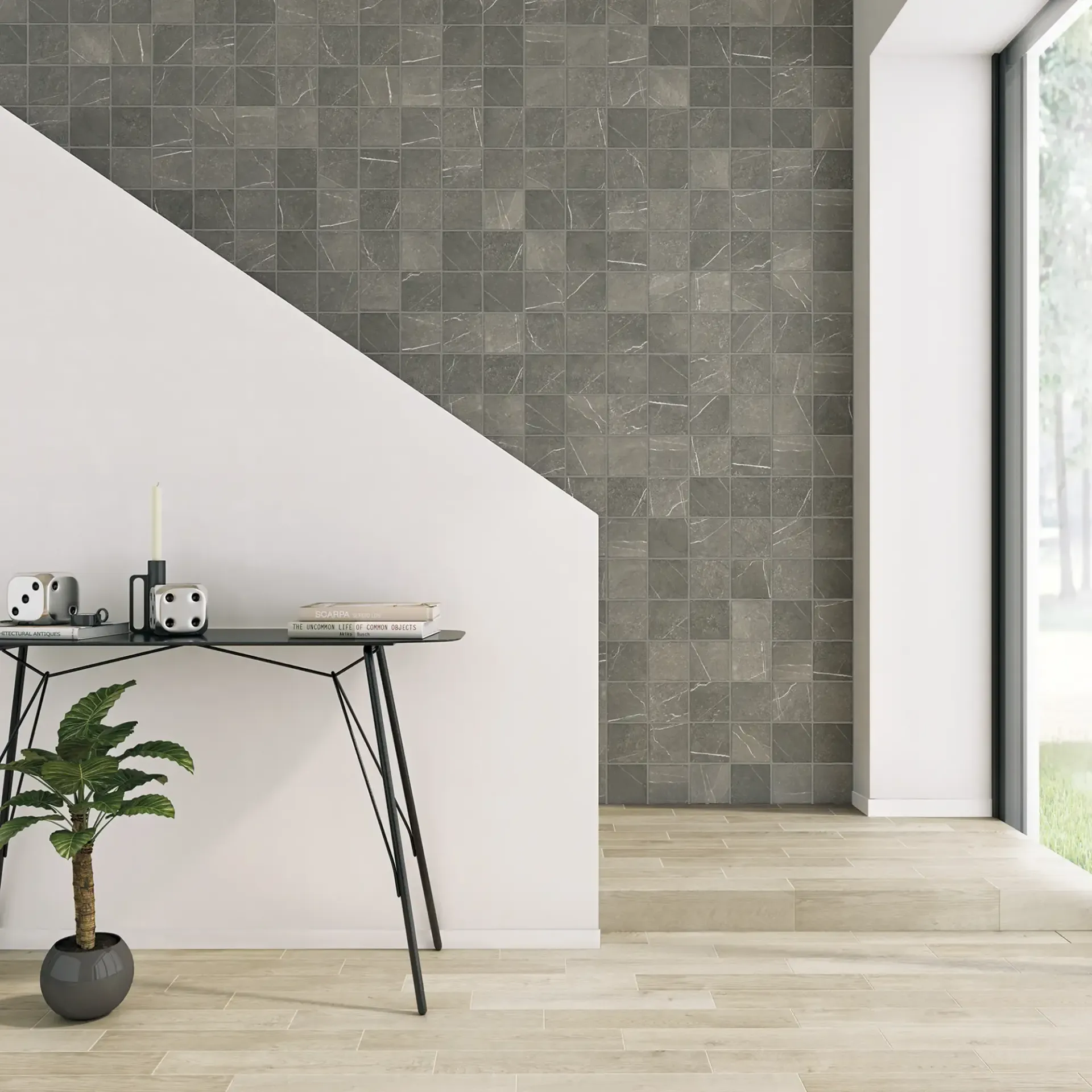Habitación moderna minimalista con escritorio, planta en maceta, pared decorativa de azulejos y luz natural que entra por la ventana.