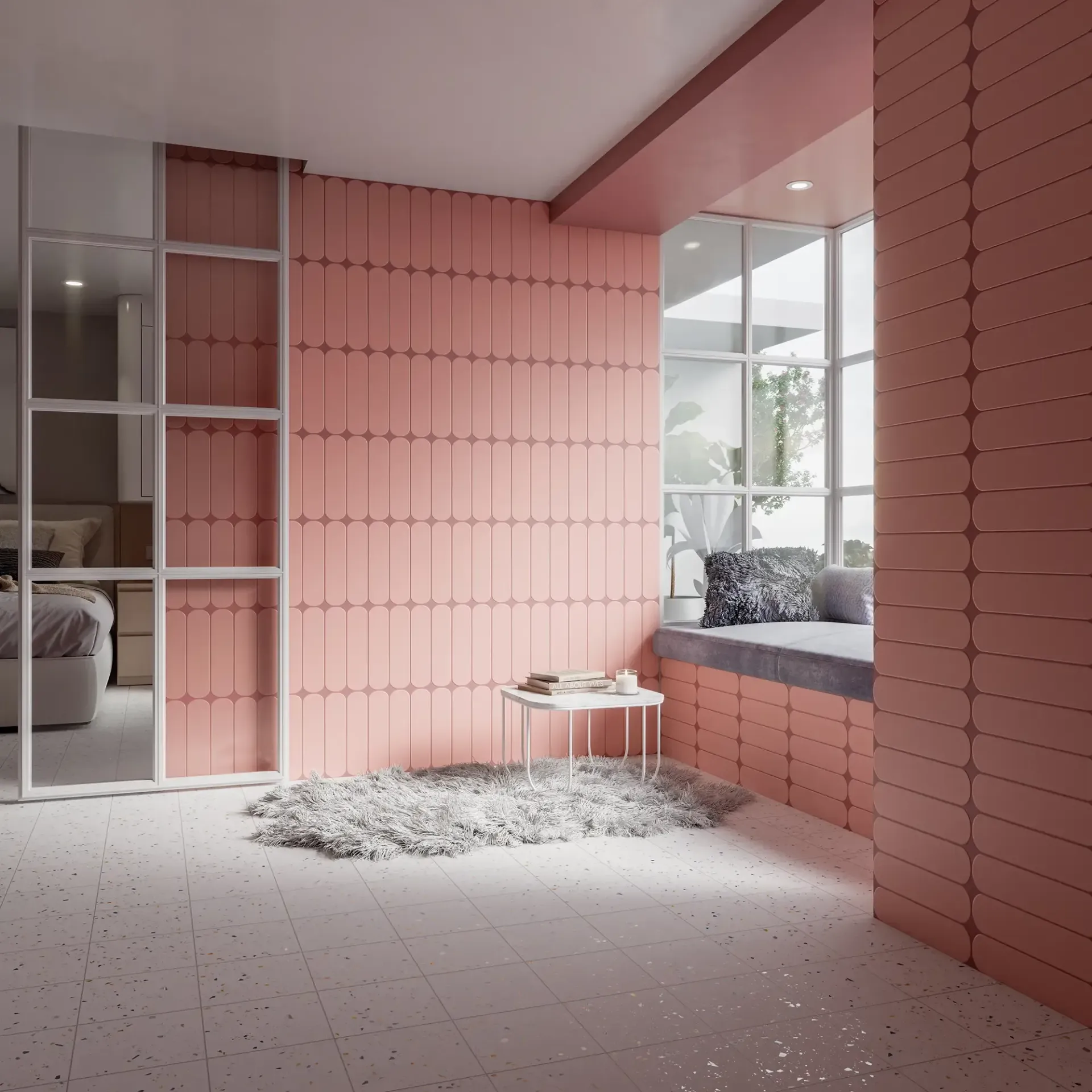 Habitación moderna de color rosa con paredes alicatadas, asiento junto a la ventana y una pequeña mesa redonda sobre un suelo texturizado.