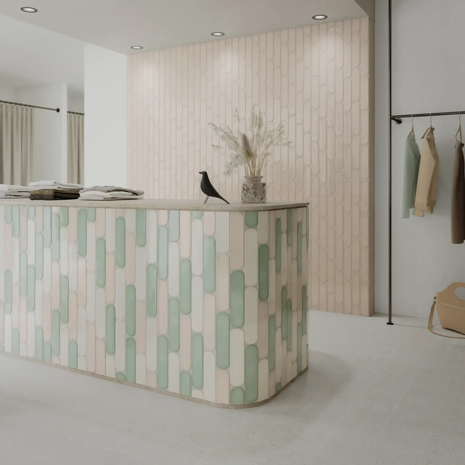Boutique moderna minimalista con mostrador estampado en tonos pastel, decoración con motivos de pájaros y percheros en un luminoso salón de exposición.