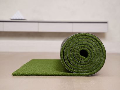 Man installing artificial grass in San Angelo, TX