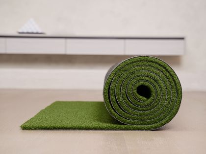 Man installing artificial grass in San Angelo, TX