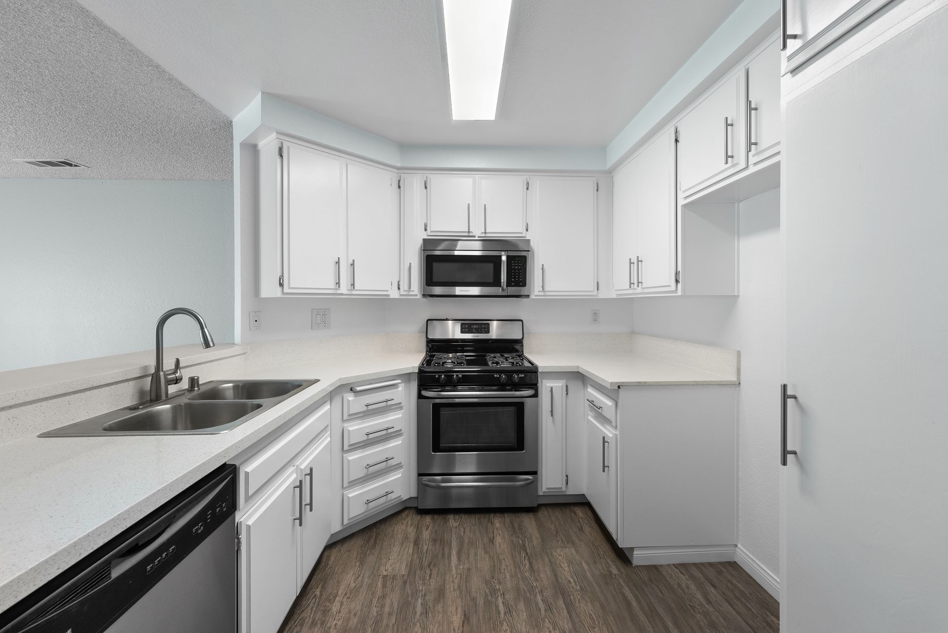 Kitchen with oven and microwave