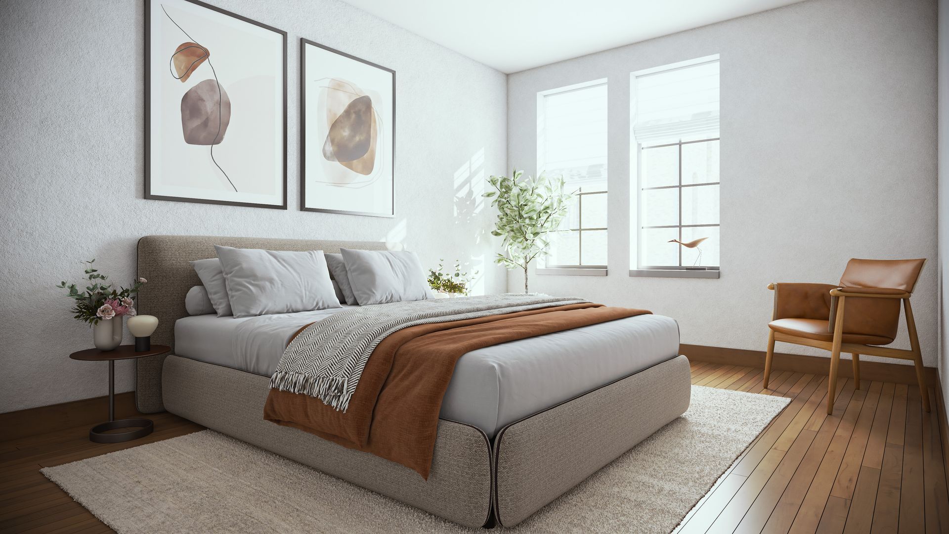 A bedroom with a large bed , chair , rug , and two paintings on the wall.
