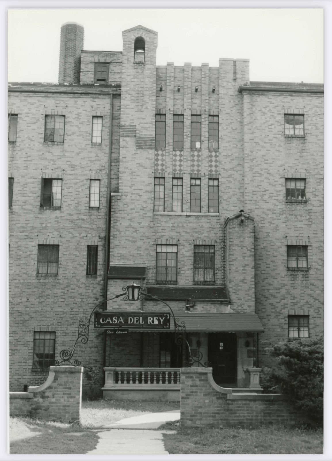 A black and white photo of a large brick building