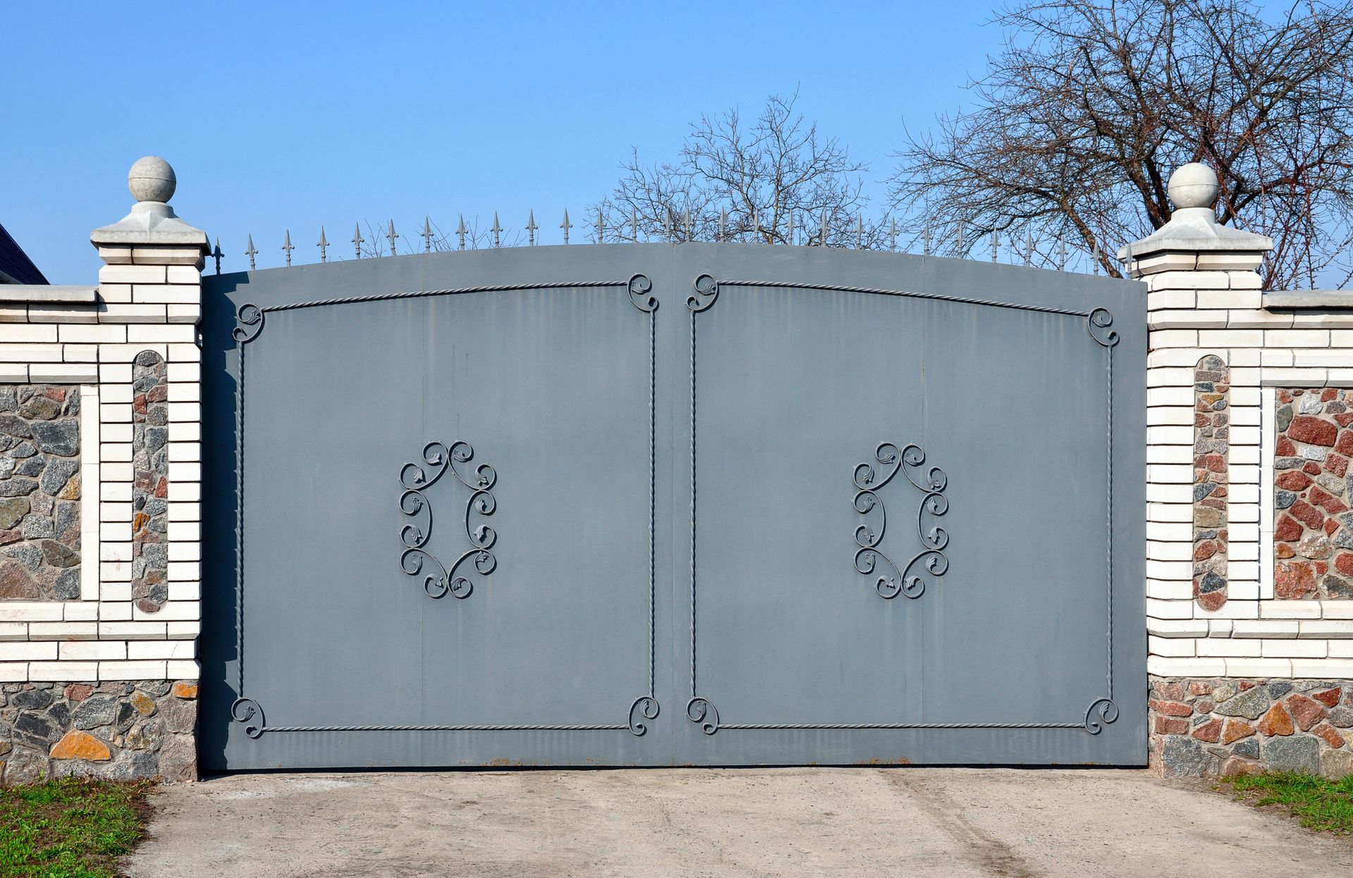 Stone gate fence showcasing elegant design, representing professional gate system installation.