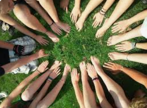 several hands together in unity