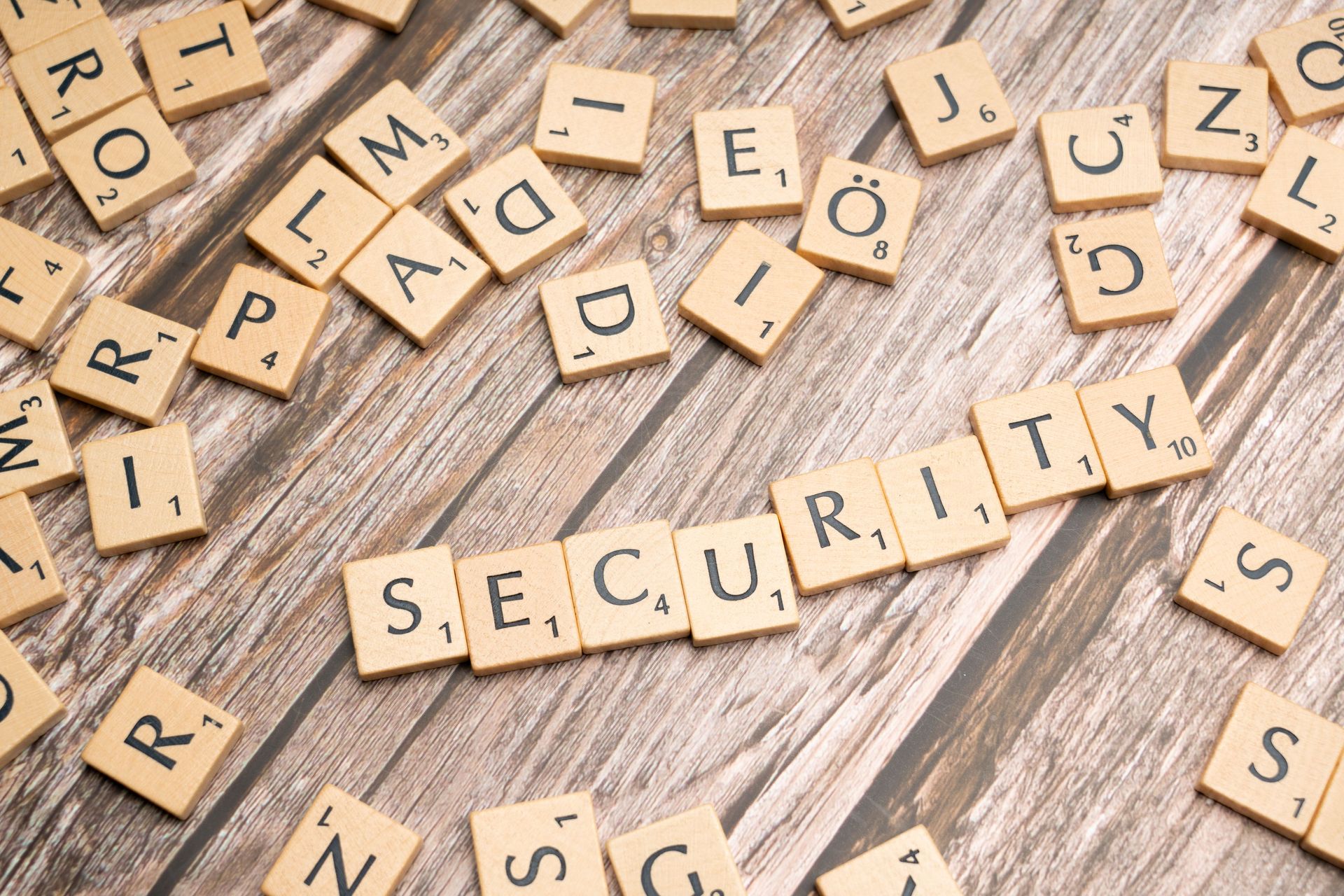 Hexagonal cybersecurity graphic with @ icons and labels for trademark, copyright, counterfeit, and product protection