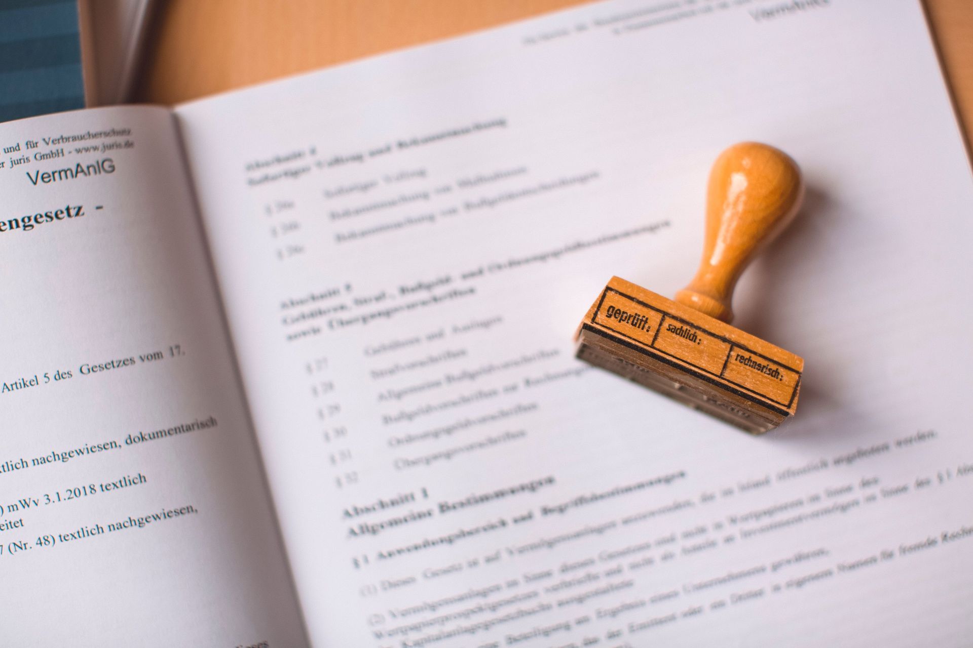 Open book with a yellow rubber stamp on the right page