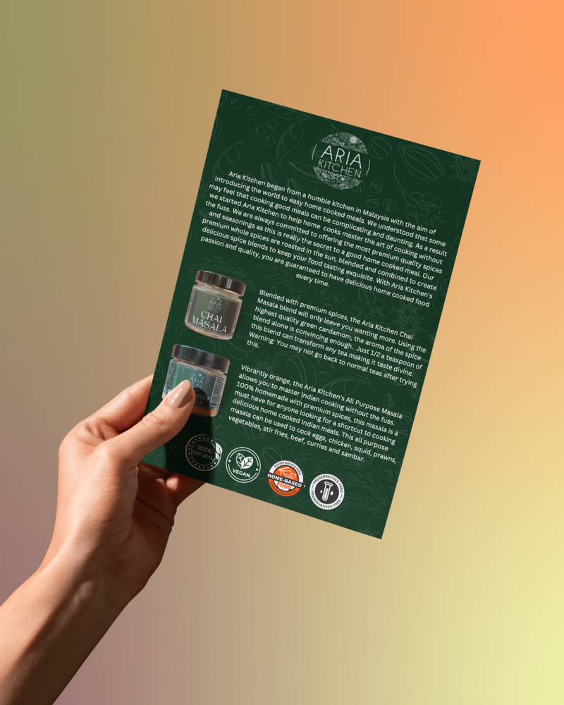 Aria Kitchen flyer held in a hand