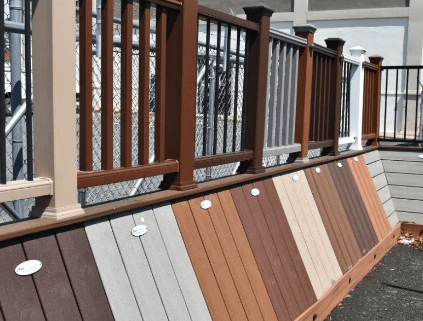 A display of different colored wooden decks and railings