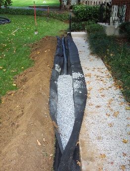 Drainage Solution with Indian Creek Rock Dry Creek Bed Groundcover
