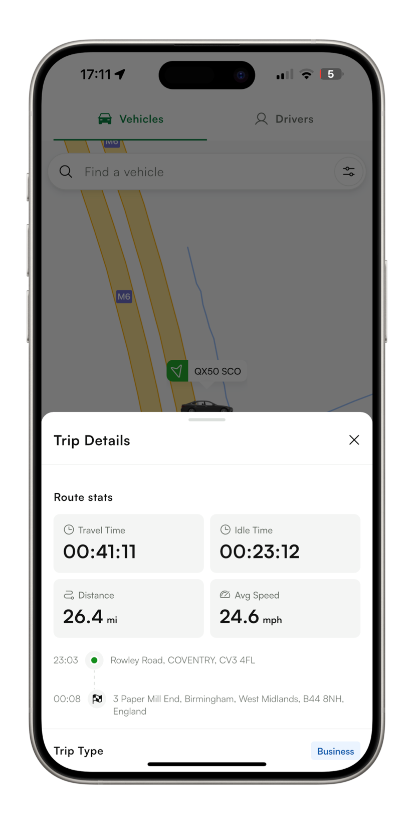A cell phone with a trip details screen on it.