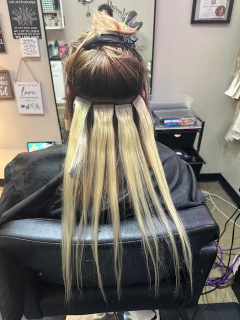 A woman is getting her hair done in a salon.