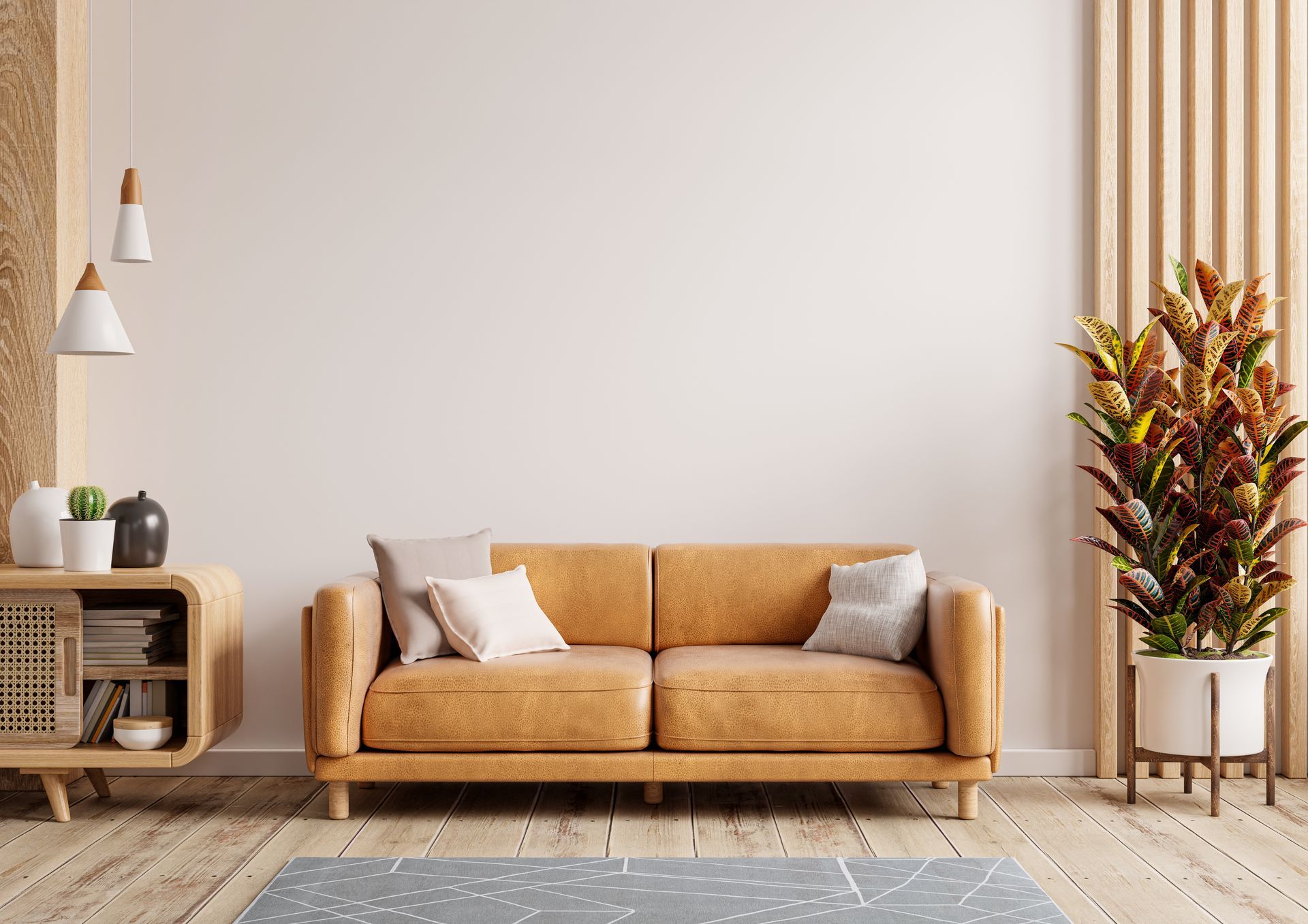 living room with leather sofa, white walls, and modern decor