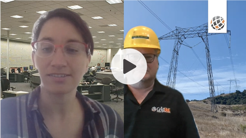A woman wearing a hard hat is talking to a man wearing a hard hat.