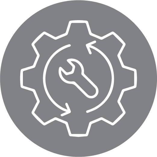 A gear with a wrench inside of it on a gray background.