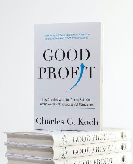 A stack of books titled good profit by charles g. koch