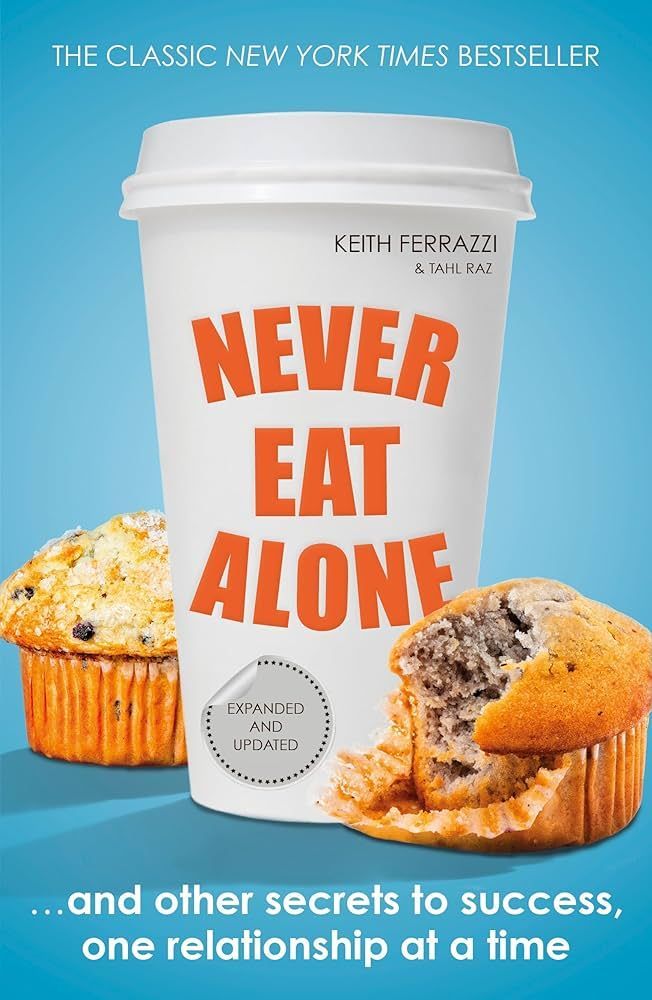 A coffee cup with the words never eat alone on it