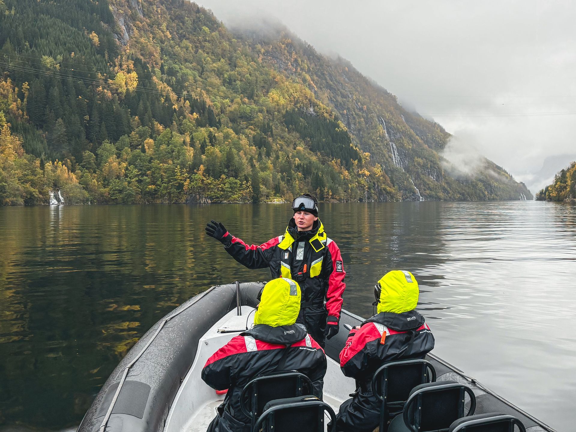 People taking pictures on a Hardangerfjord winter RIB safari