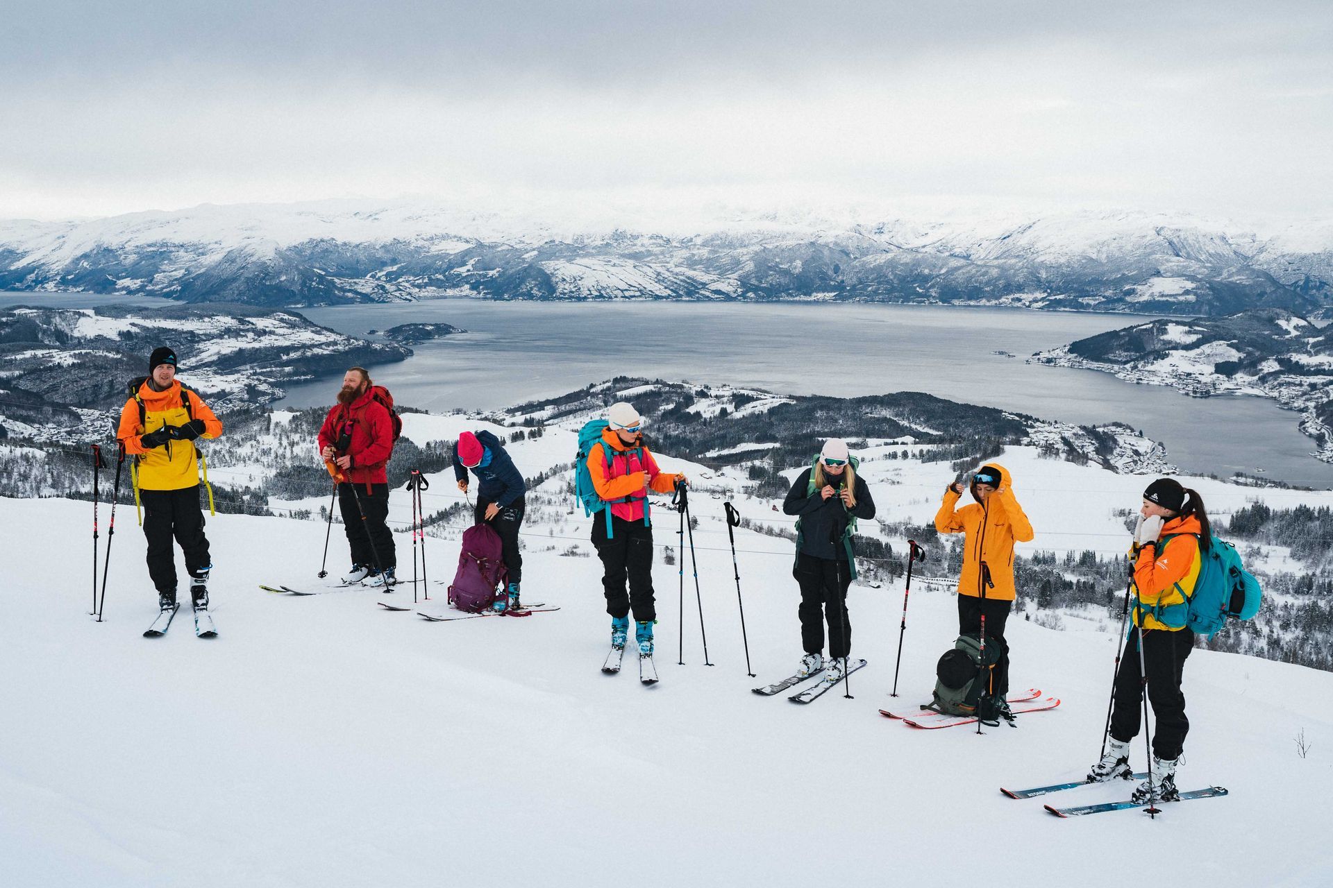 People reaching the peak on a ski touring in Hardanger