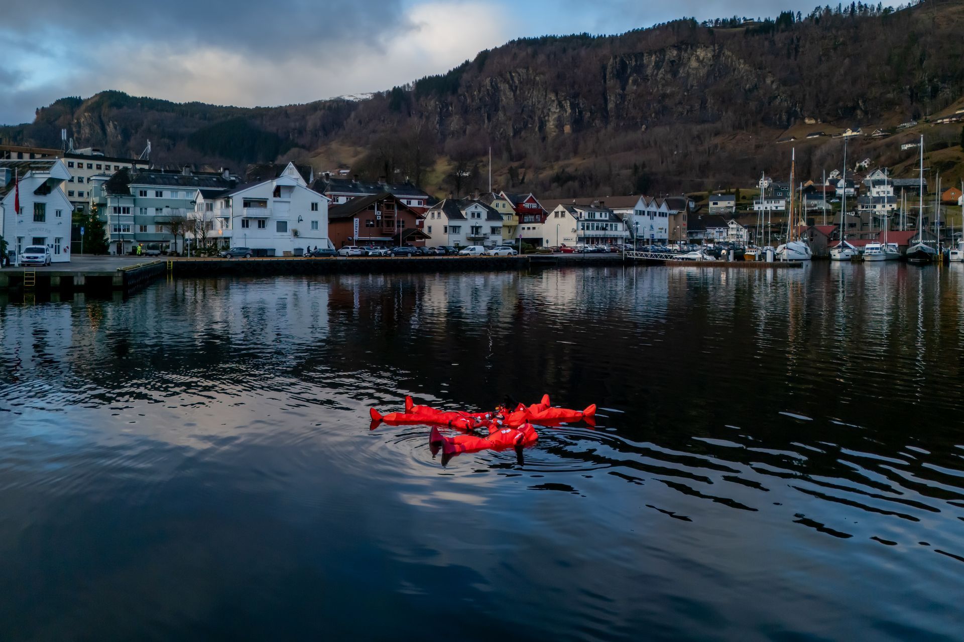 A person floating in the fjord in Norheimsund in the winter season.