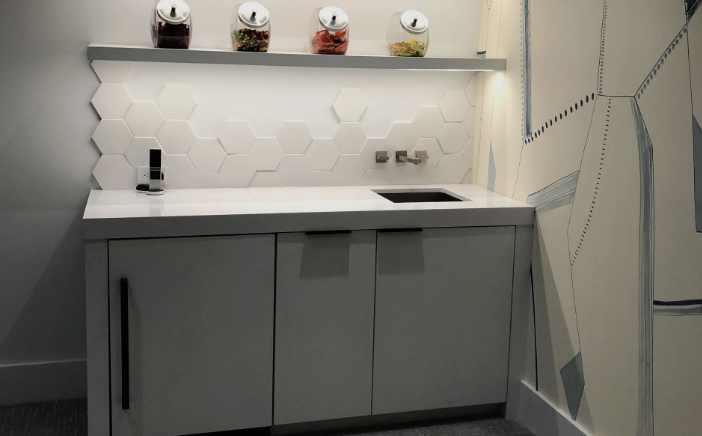 A white entertainment center with a flat screen tv