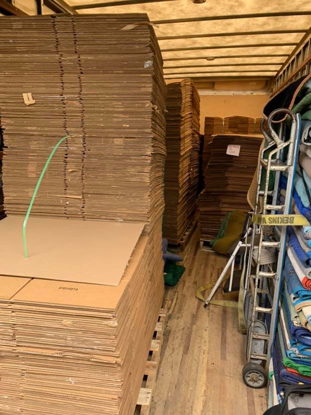 Woman Labeling A Transparent Box — Newton, WI — Nomad Moving Services Woman Labeling A Transparent Box — Newton, WI — Nomad Moving Services