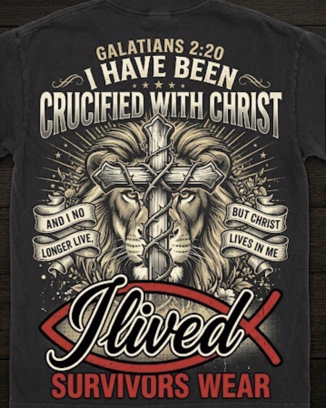 Galatians 2:20 lion and cross design on the back of a black T shirt
