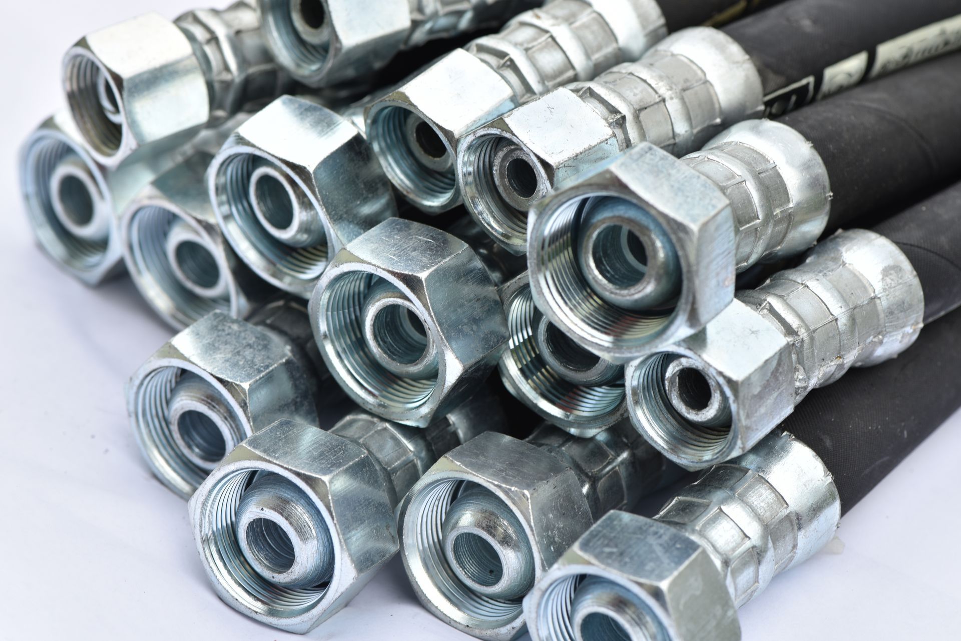 Close-up of hydraulic hoses on a white background Close-up of hydraulic hoses on a white background